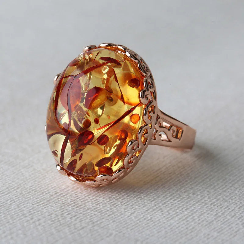 Amber ring with beeswax-coloured genuine amber stone in retro ethnic alloy setting