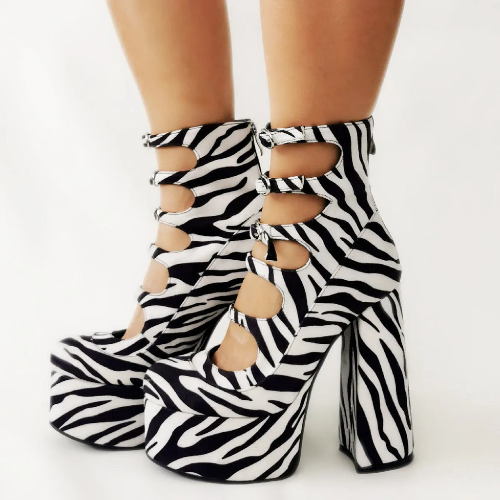 Women's black patent leather waterproof platform high heel boots with a thick heel and serpentine ankle strap.