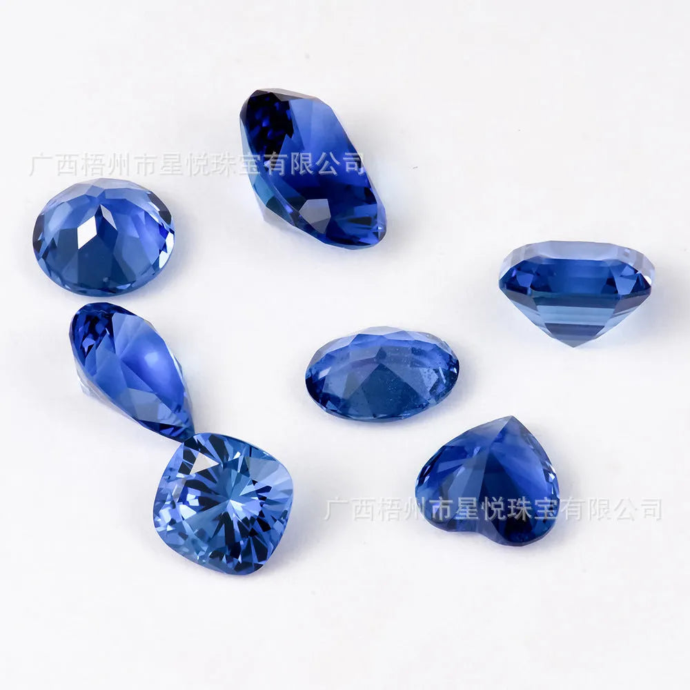 Royal blue love-shaped tiara cut gemstone for jewellery making on a white background.