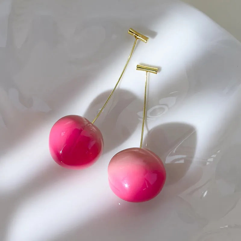 Acrylic peach fruit earrings in small and large size variations with copper findings