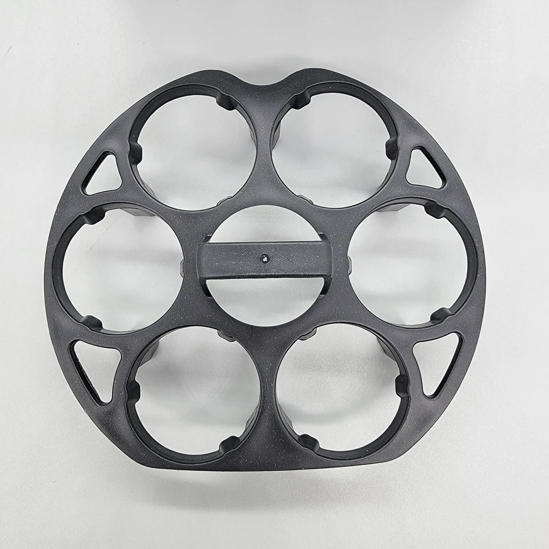 Black plastic egg holder with retainer design for kitchen storage, measuring 13.8cm by 12.6cm