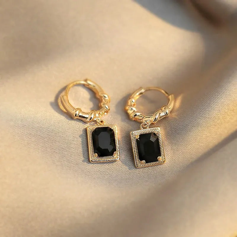 Geometric quadrilateral copper earrings with black zircon detailing in E2506 Black colour