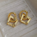 Retro geometric circle drop earrings in gold or silver colour with a 3.4cm copper pendant.