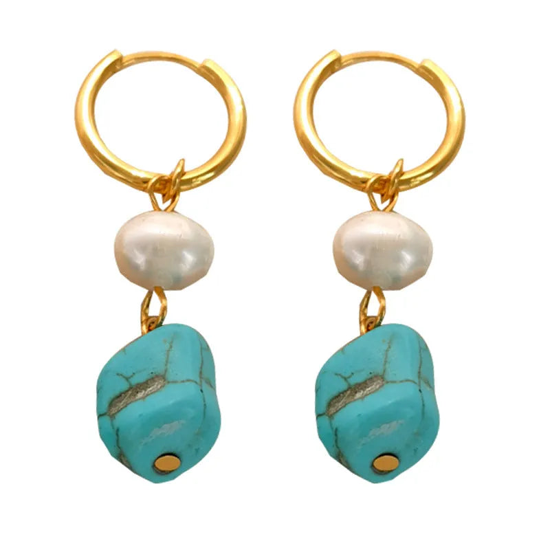 Geometric irregular shaped copper clip-on earrings with turquoise stones and cultured pearls.