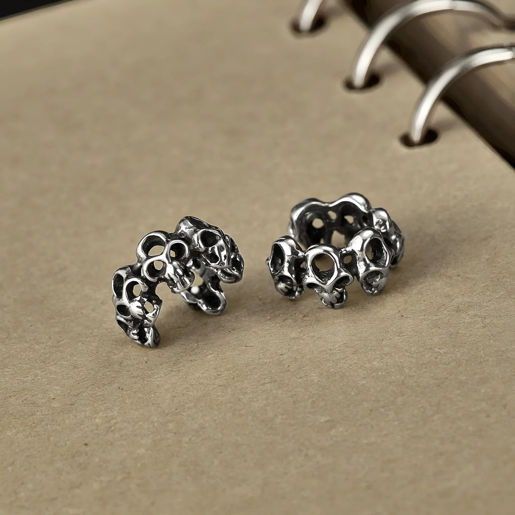 Retro geometric skull earrings in stainless steel with ear clip fitting.