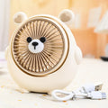 Cute dog shaped USB powered desk fan with three speed settings on a wooden table.