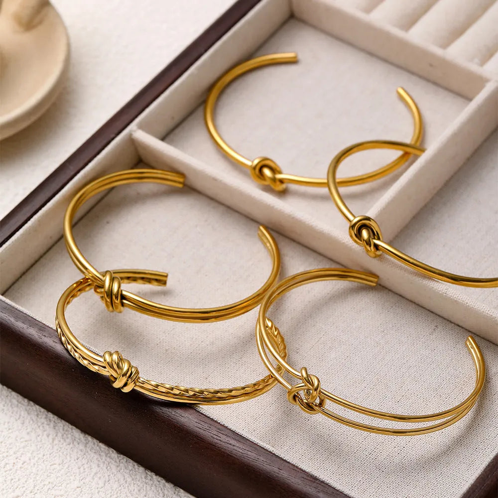 Gold plated stainless steel knotted C-shaped open double-layer adjustable women's bracelet.