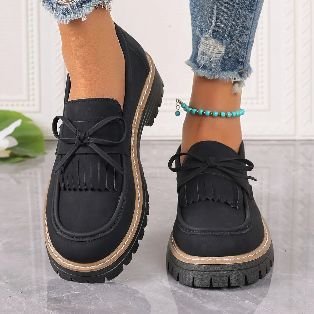 Women's black plus size loafers with tassel decoration, chunky heel, and round toe design