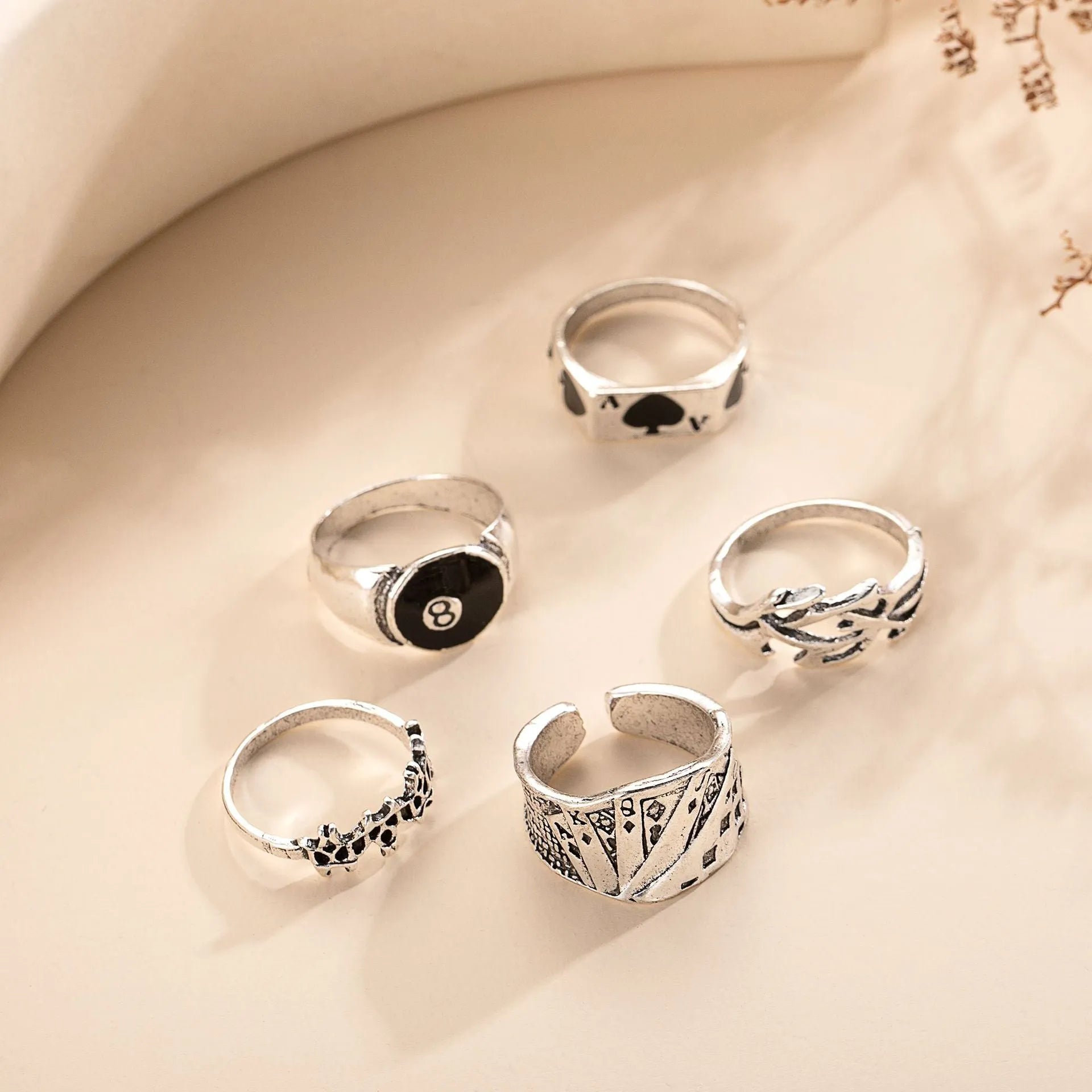 A black alloy ring for women featuring a raised retro poker card spade design.