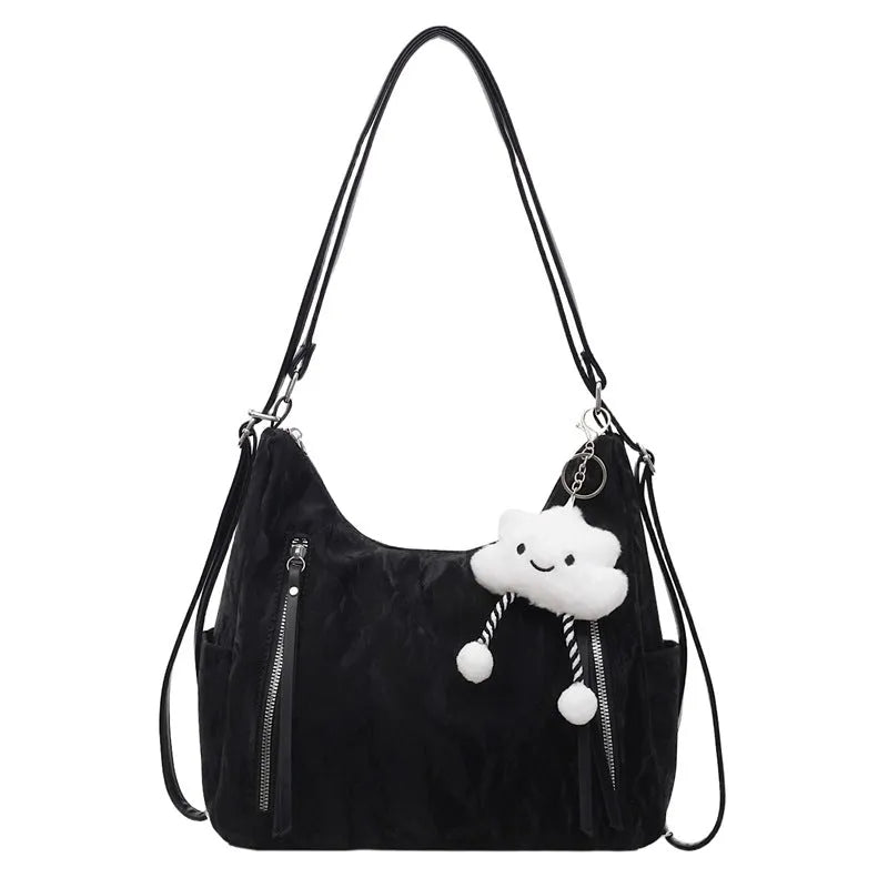 Women's soft PU fashion backpack in black colour with pendant accessory