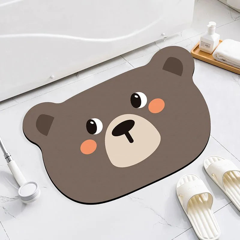 Cute animal cartoon design diatom oil absorbent non-slip bathroom mat on tiled floor.