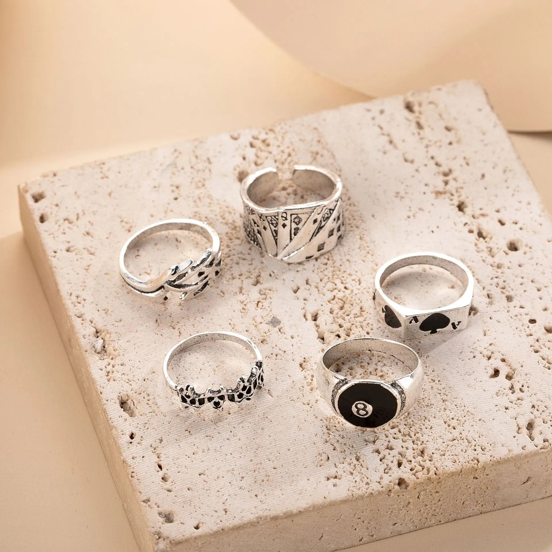 A black alloy ring for women featuring a raised retro poker card spade design.