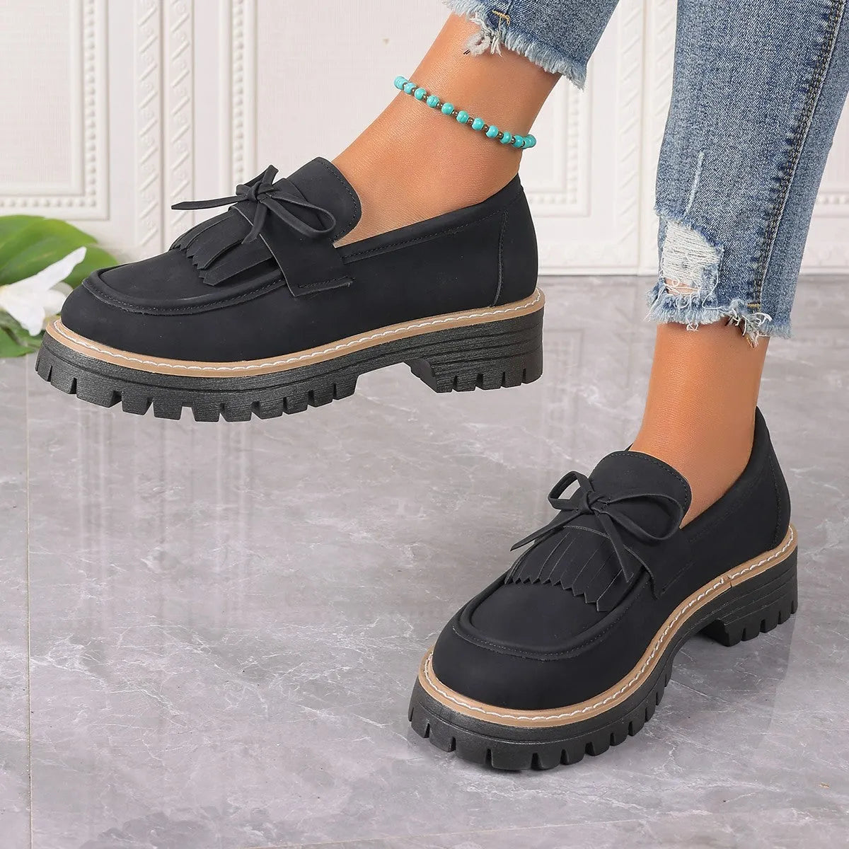 Women's black plus size loafers with tassel decoration, chunky heel, and round toe design