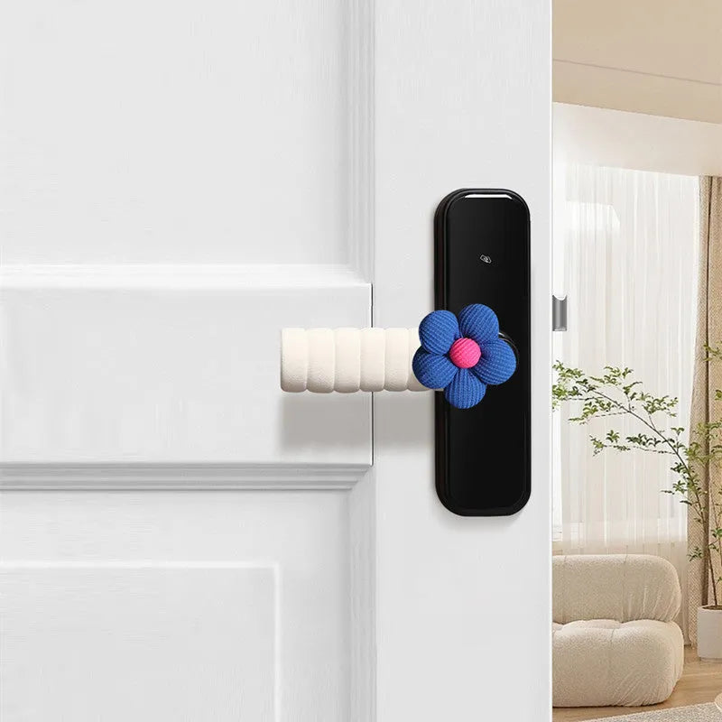 Flower pattern soft PEVA door handle protective cover on a round door knob.