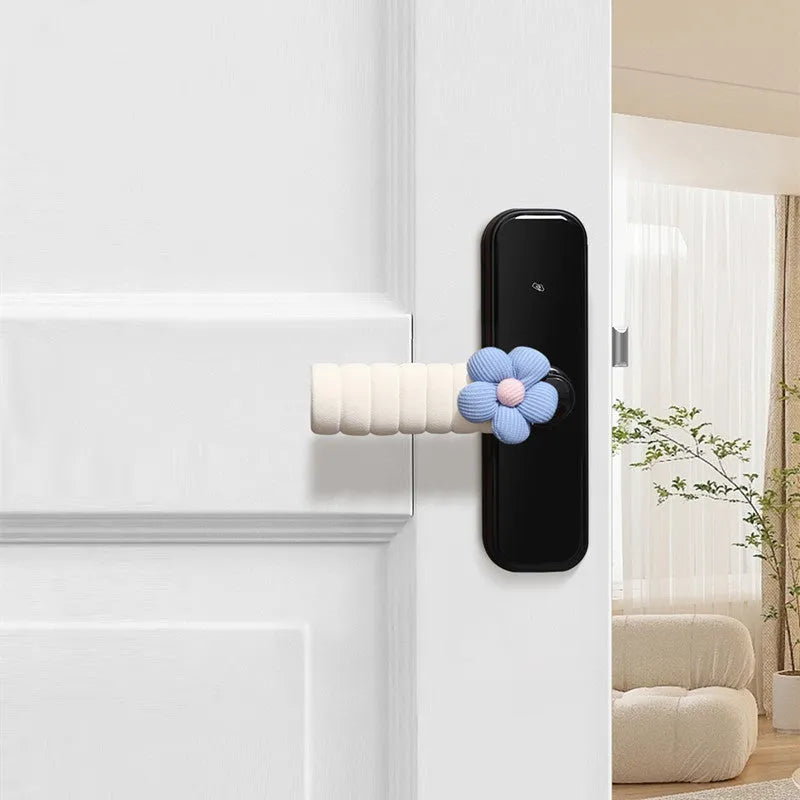 Flower pattern soft PEVA door handle protective cover on a round door knob.
