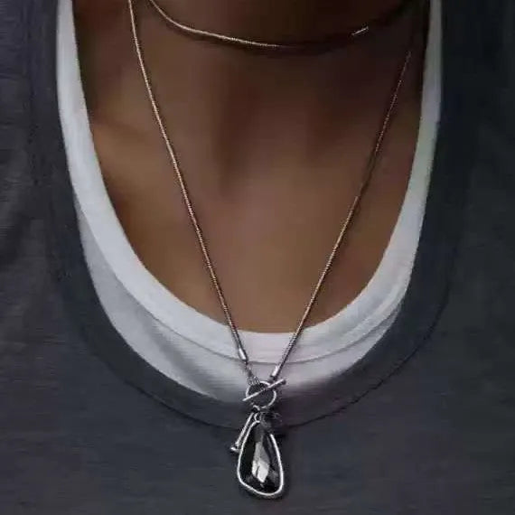 Women's long sweater chain necklace with geometric plaid pattern pendant on snake bones chain