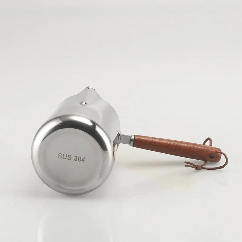 Stainless steel coffee cup with measurement scale markings and wooden handle shown in solid colour