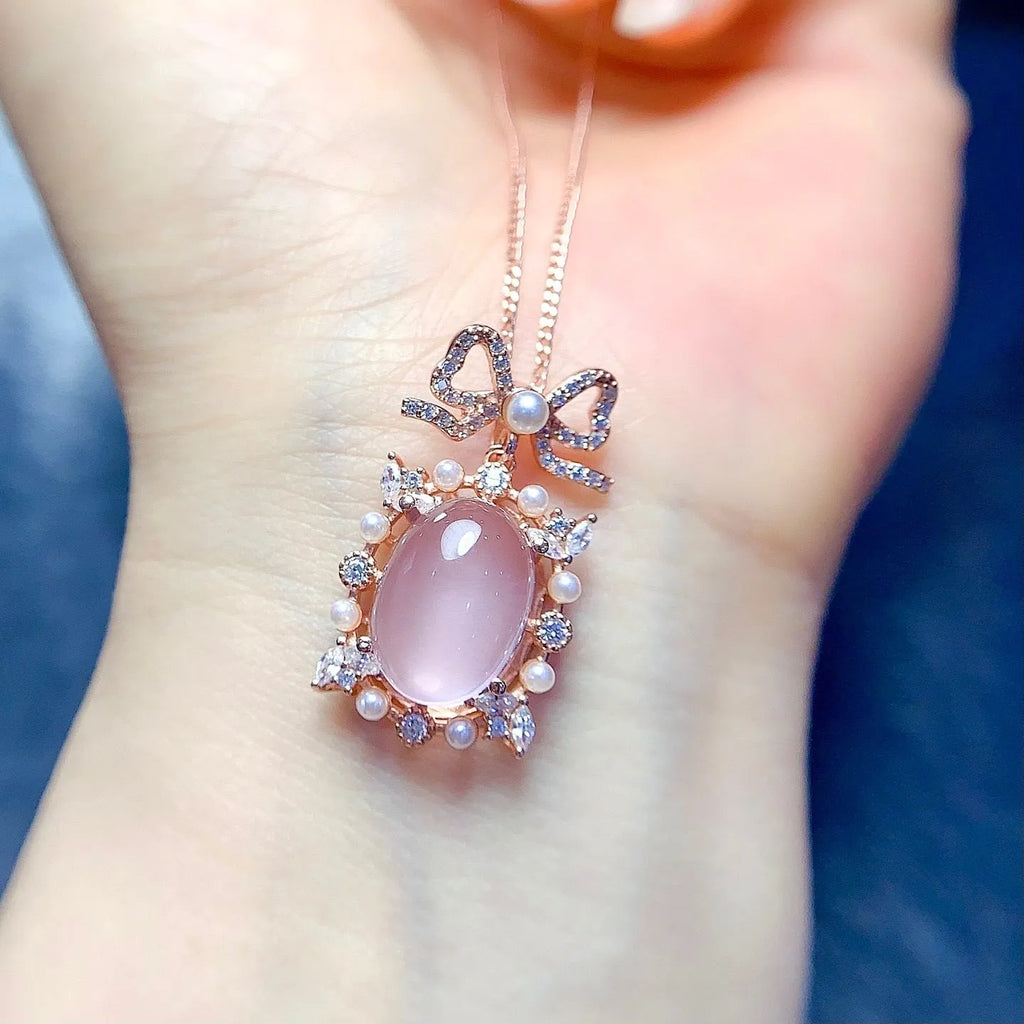 Geometric rose quartz pendant on a silver chain with rose gold plating