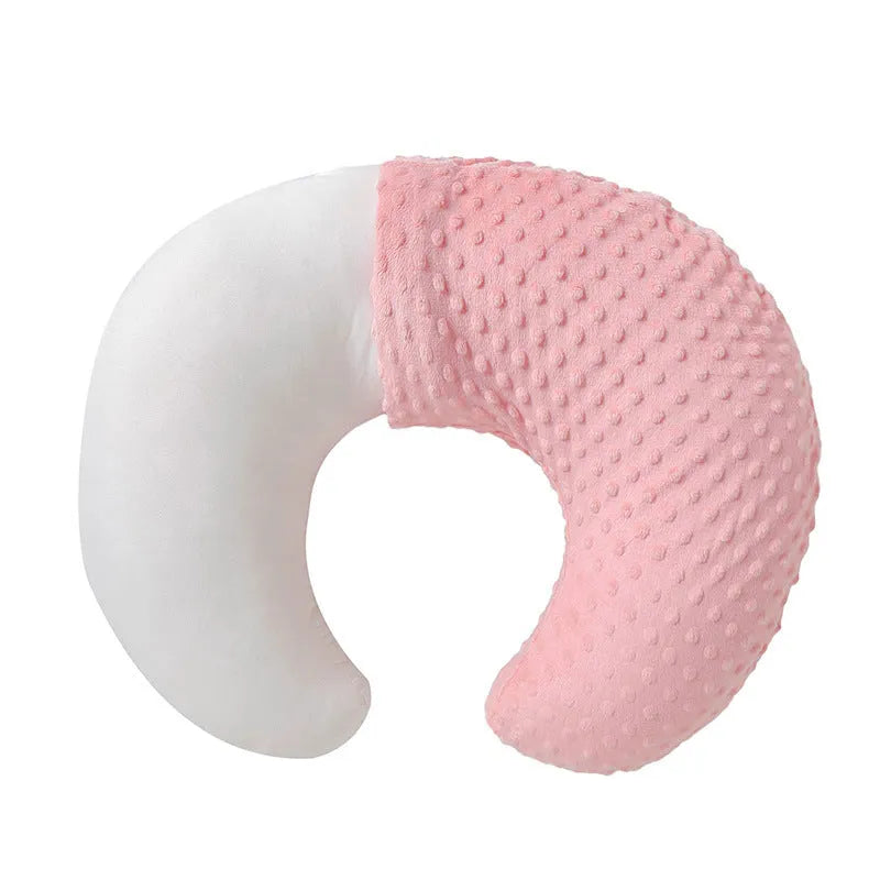 Grey nursing pillow with milk spill prevention feature for breastfeeding support