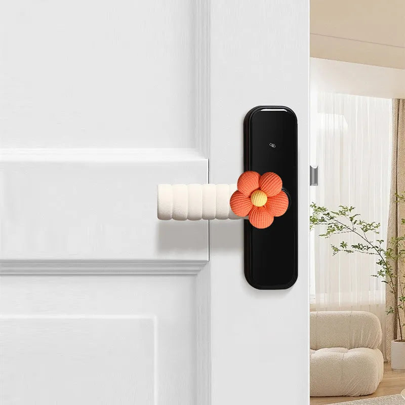 Flower pattern soft PEVA door handle protective cover on a round door knob.