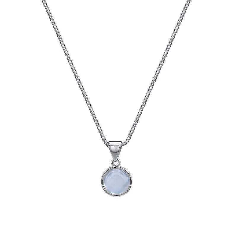 Women's oval artificial crystal pendant necklace with eight-point star design on an adjustable box chain.
