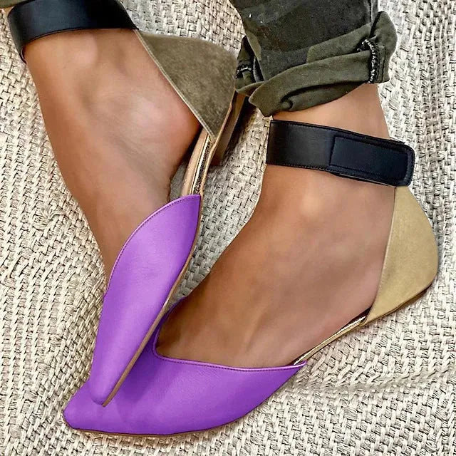Women's beige velcro-strap sandals with hollowed pattern design on the flat upper.