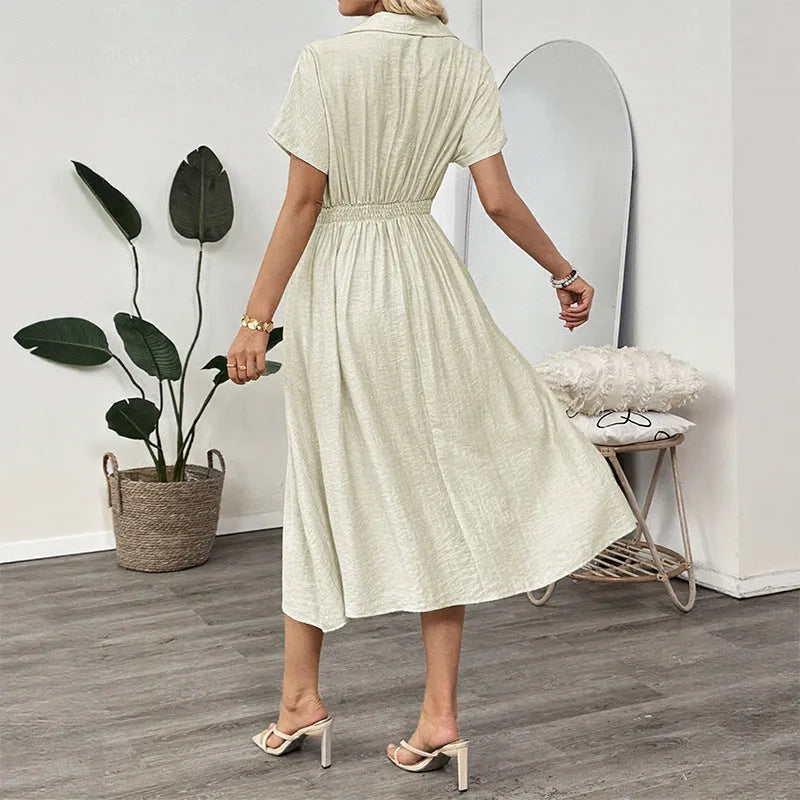 Light green lapel shirt dress with waist-tight skirt and pocket for office wear.
