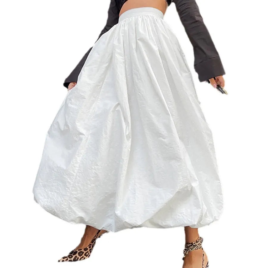 Women's solid colour cotton long skirt on a hanger, available in black or white.
