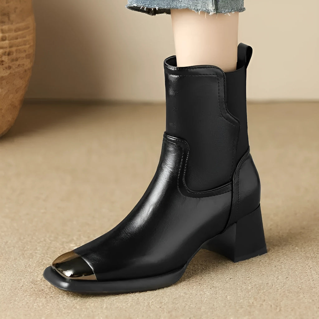 Brown high-heel Martin boots made of cowhide leather with a side zipper closure.