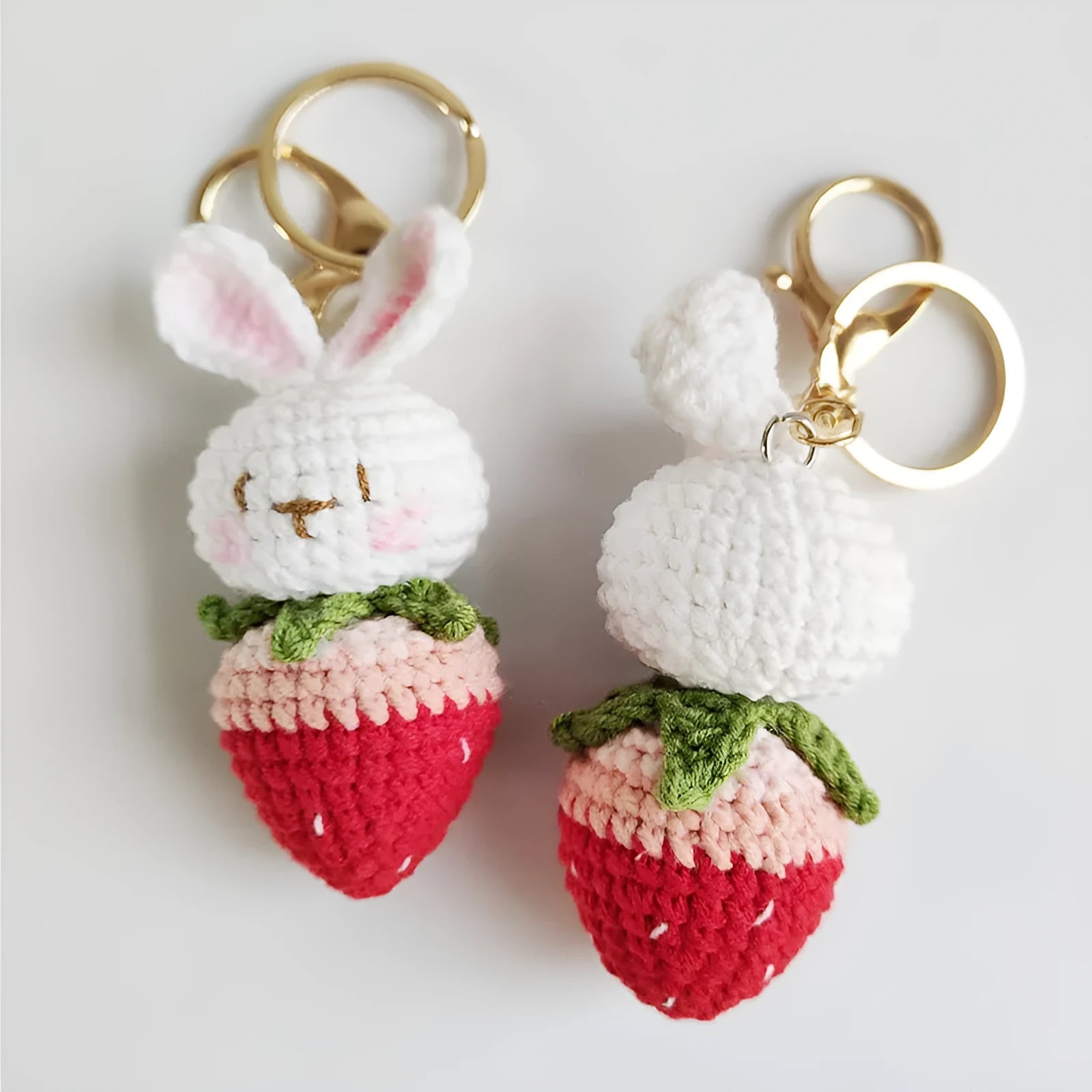 Hand-woven white wire pendant with rabbit strawberry cartoon design and key attachment