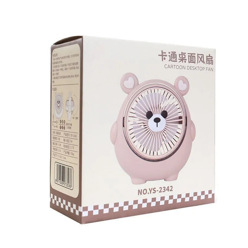 Cute dog shaped USB powered desk fan with three speed settings on a wooden table.