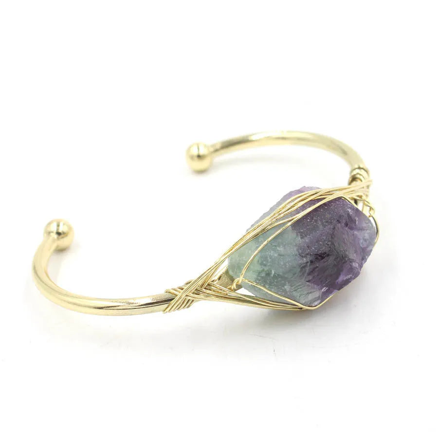 Natural raw gemstone bracelet with amorphous 8mm beads and a simple metal opening clasp.