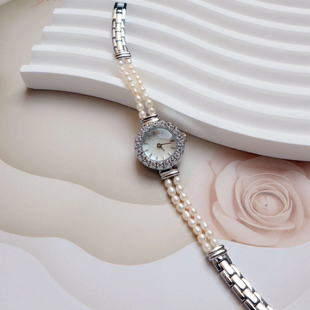 Women's light gold bracelet watch with freshwater pearls, round 18mm dial, stainless steel strap
