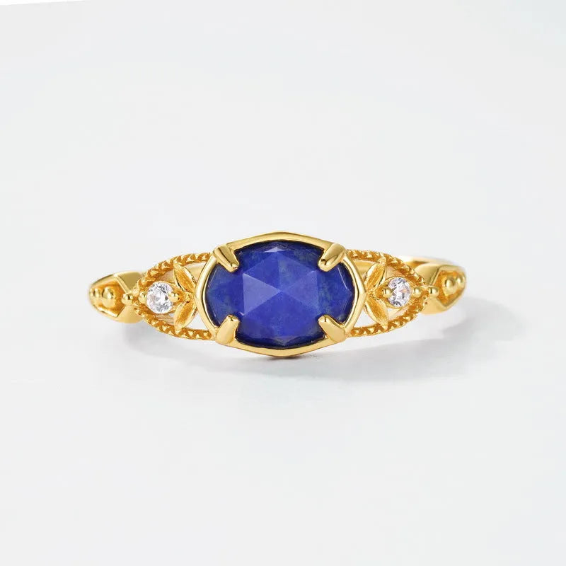 Japanese style silver alloy ring with blue elliptical lapis lazuli stone and geometric design.