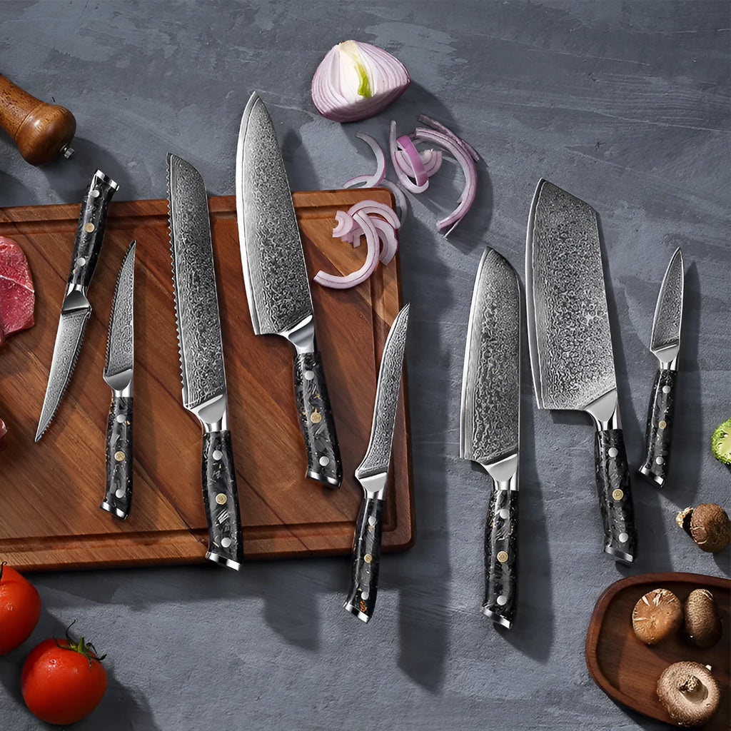 Damascus steel kitchen knife set showing eight different blade sizes with fishbone pattern detailing