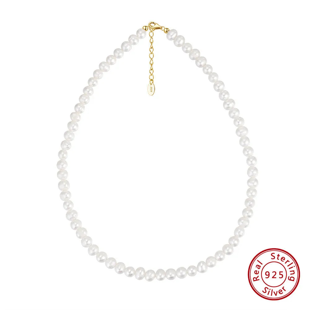 Women's simple adjustable necklace with natural freshwater pearls on a sterling silver chain.