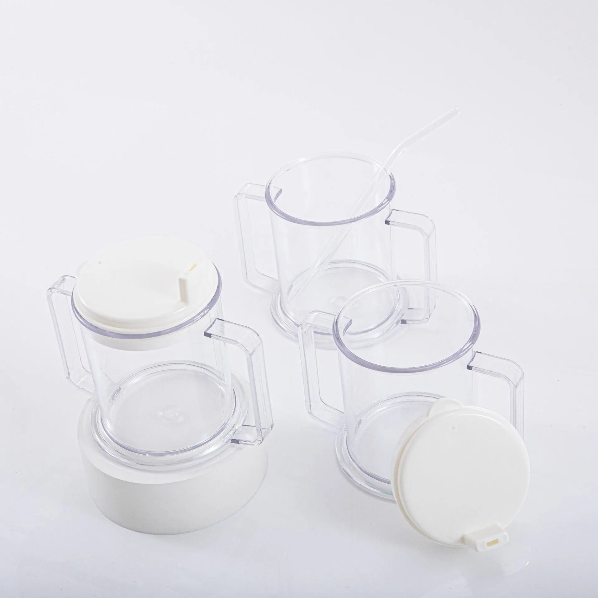 Transparent plastic drinking cup with spill-proof lid showing 14cm height and 12cm diameter dimensions