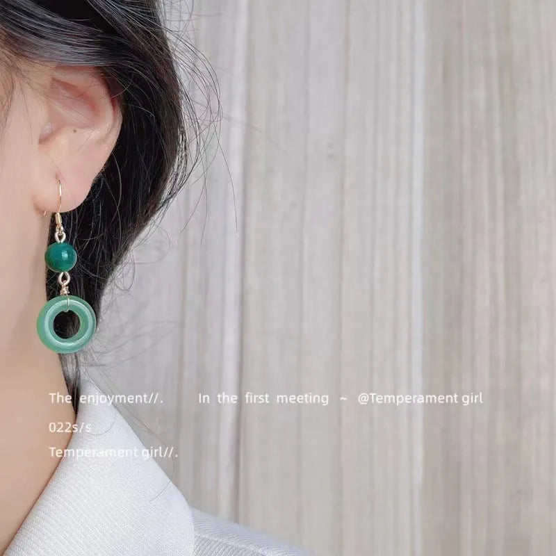 Green Chinese style peace buckle shape earrings with geometric ring design
