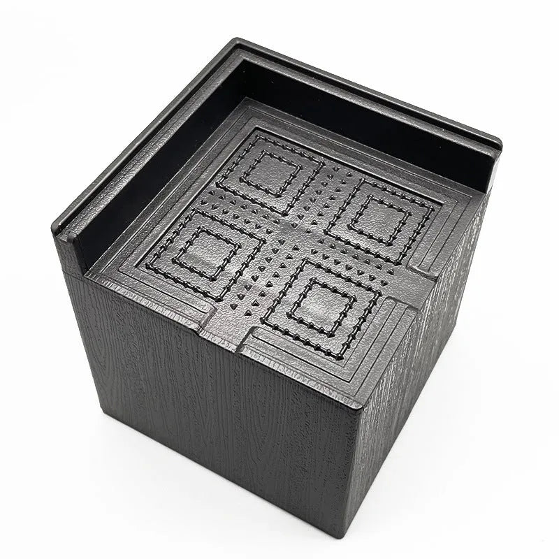 Black plastic bed foot mat set for furniture height increase in four piece pack