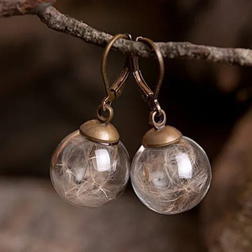 Transparent glass ball earrings with dandelion seed design on silver French hook