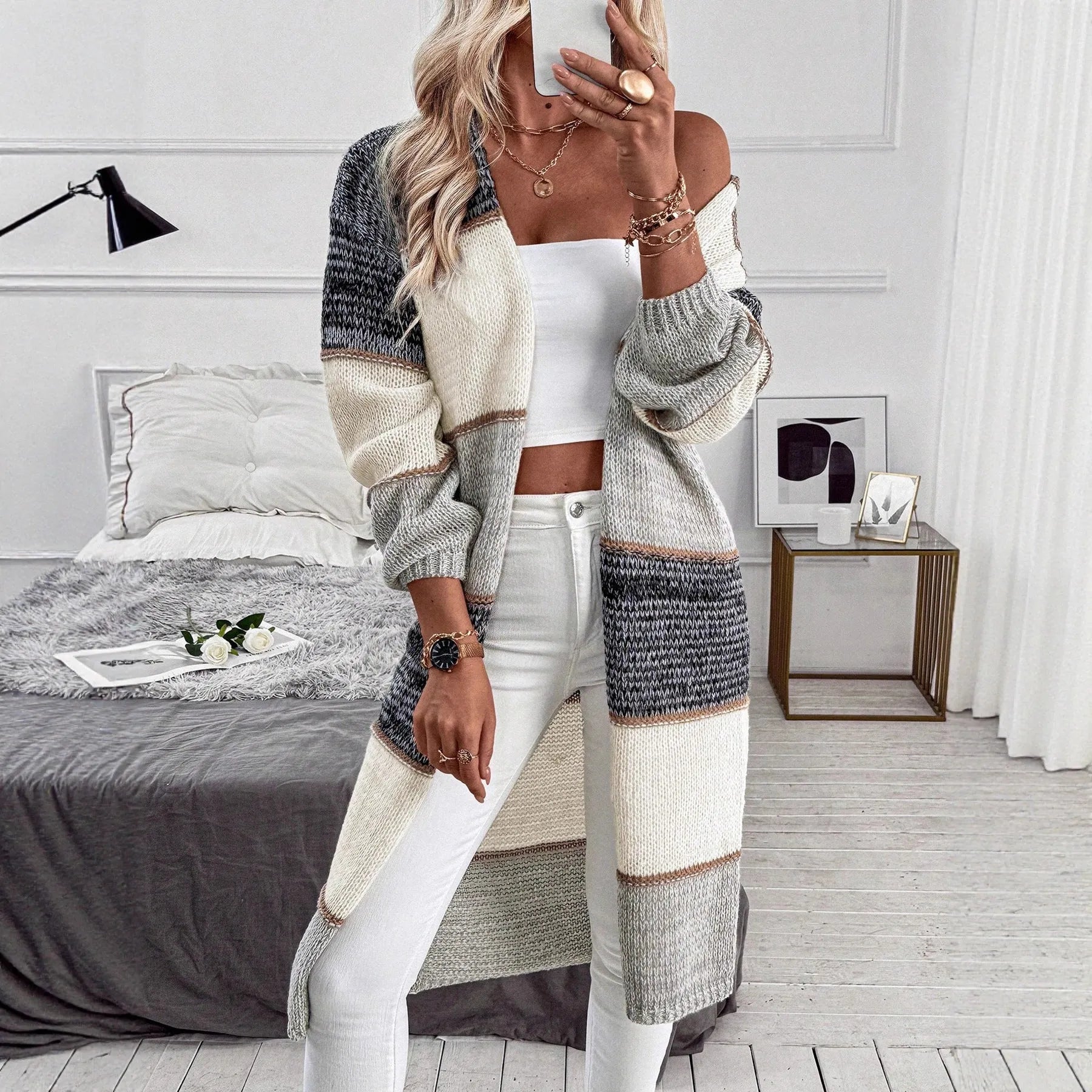 Grey women's knitted cardigan with loose fit and long sleeves