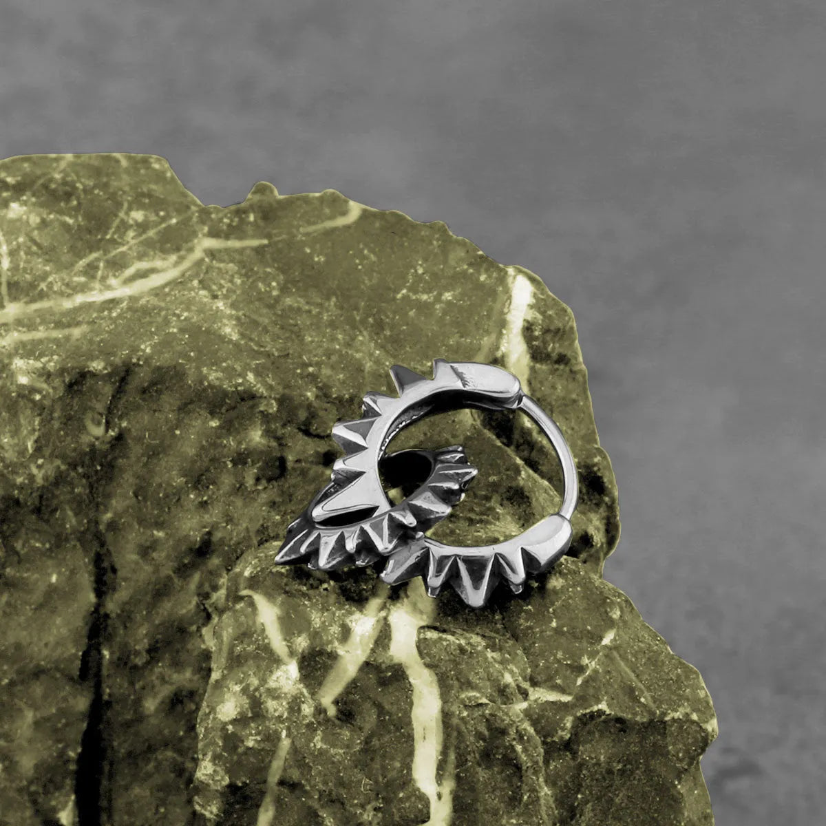 Polished stainless steel round hoop earrings in a steel colour with a simple retro design.