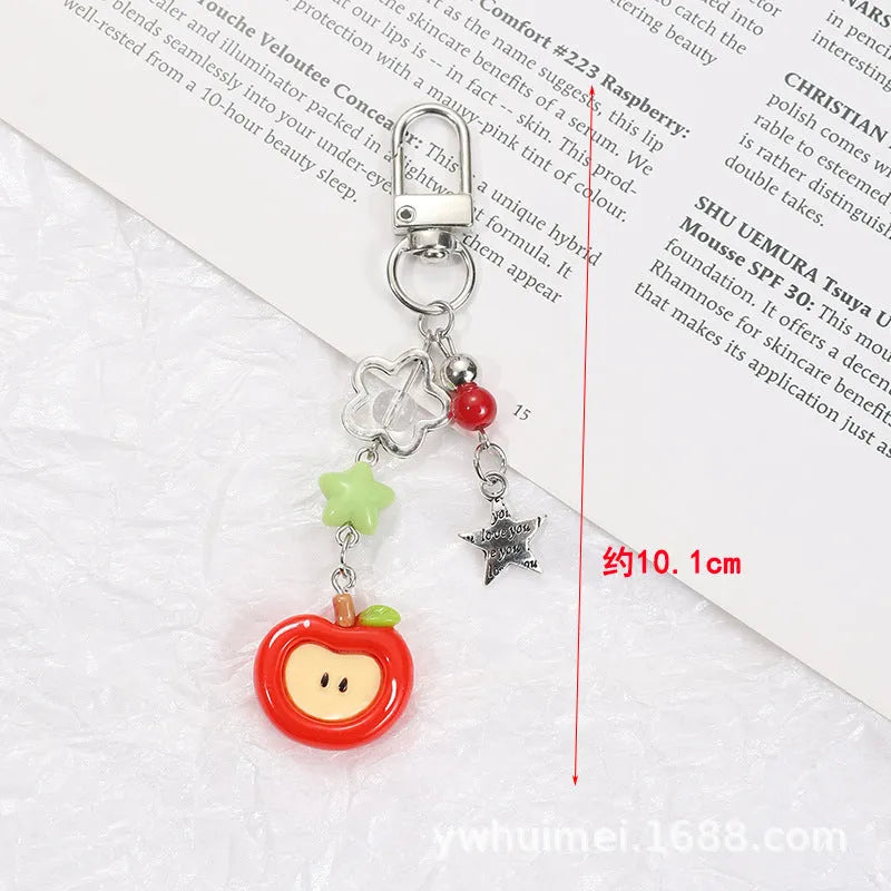 Fruit pattern mobile phone charm keychain with apple and strawberry designs in plastic resin material