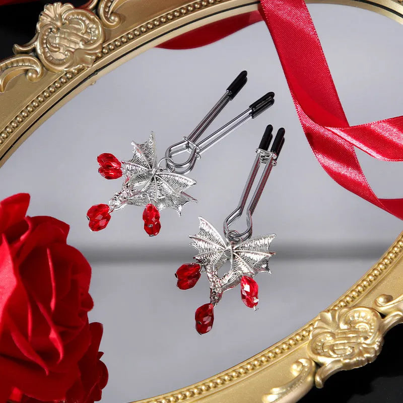 Silver alloy diamond bat nipple clamp with adjustable tension and ruby bat clip design