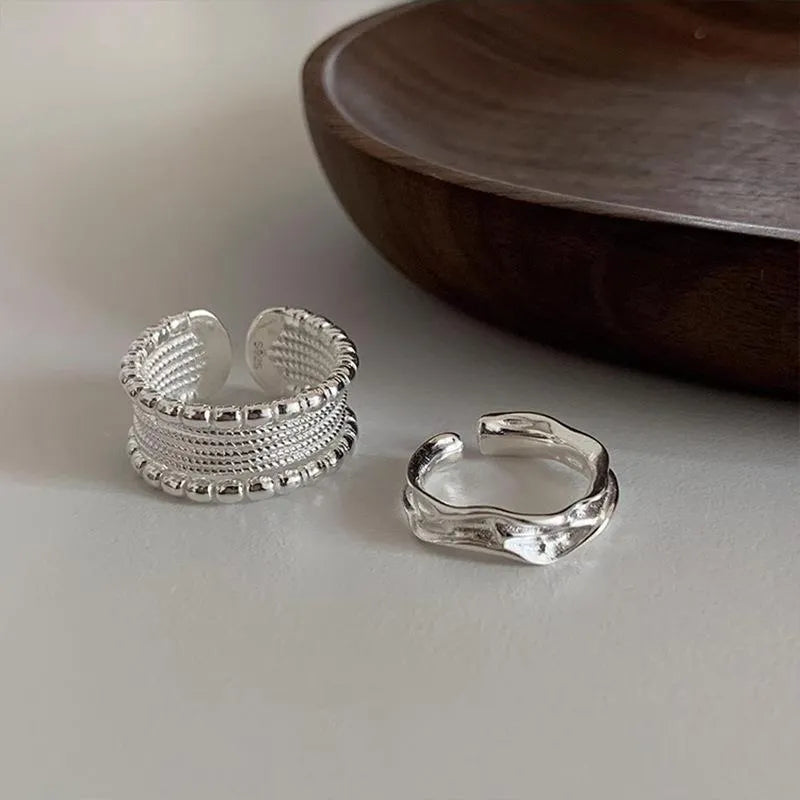 Copper alloy geometric ring with woven twisted multilayer design and adjustable opening