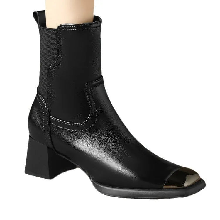 Brown high-heel Martin boots made of cowhide leather with a side zipper closure.