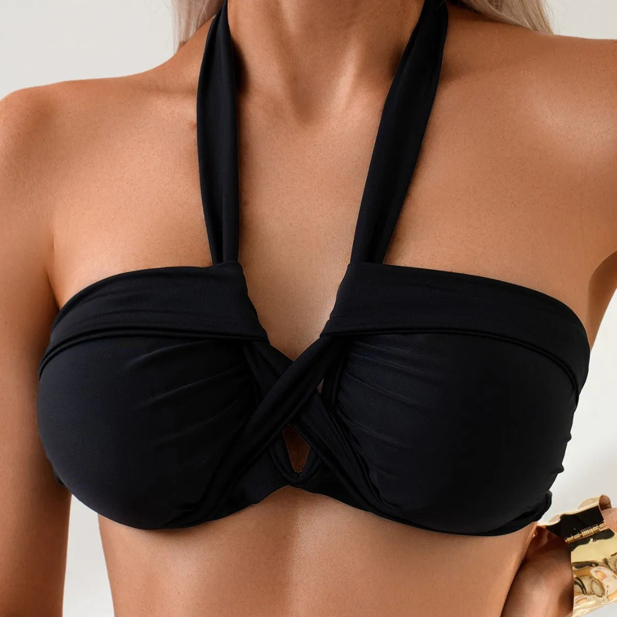 Black women's backless bikini swimsuit in briefs style on a white background.