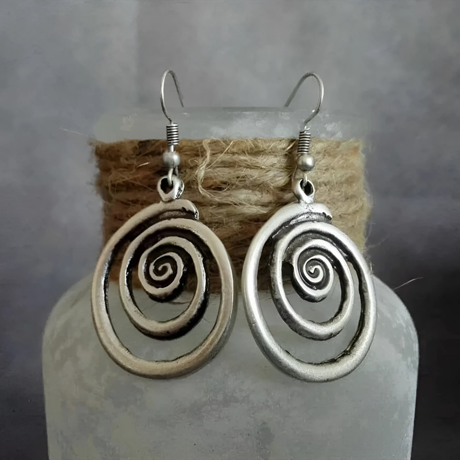 Retro geometric spiral earrings with distressed silver finish measuring 2.6 by 5 centimetres