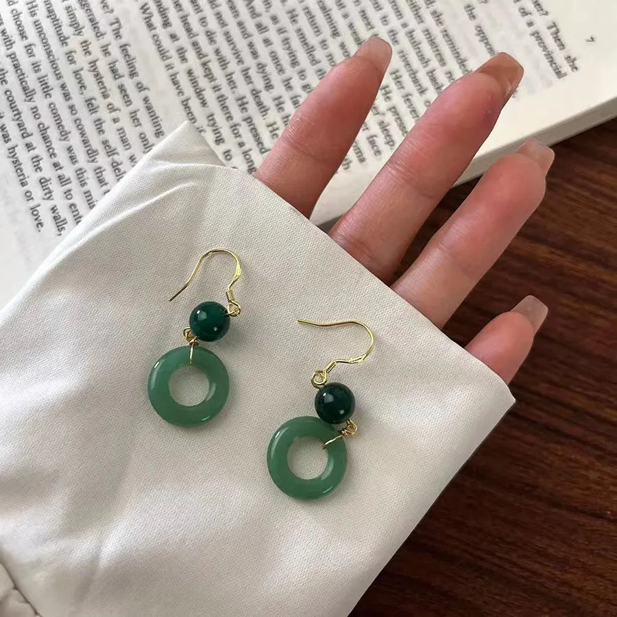 Green Chinese style peace buckle shape earrings with geometric ring design