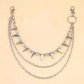 Silver punk pants chain with double layers, zipper detail, and rivet accents against dark background